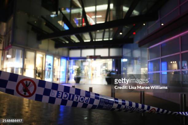 Police tape surrounds the entrance to Westfield Bondi Junction on Oxford Street on April 13, 2024 in Bondi Junction, Australia. Five victims, plus...