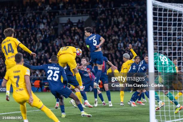 The corner kick eludes Marquinhos of Paris Saint-Germain as Andreas Christensen of Barcelona heads Barcelona's winning goal while defended by Warren...