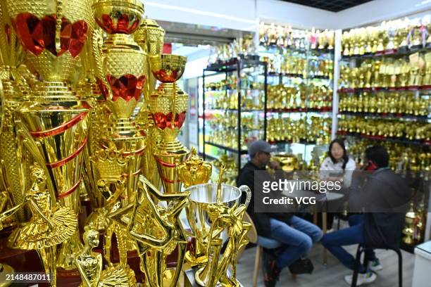 Merchants select trophies at Yiwu International Trade City on April 12, 2024 in Yiwu, Zhejiang Province of China. China's Yiwu sees rising demand for...