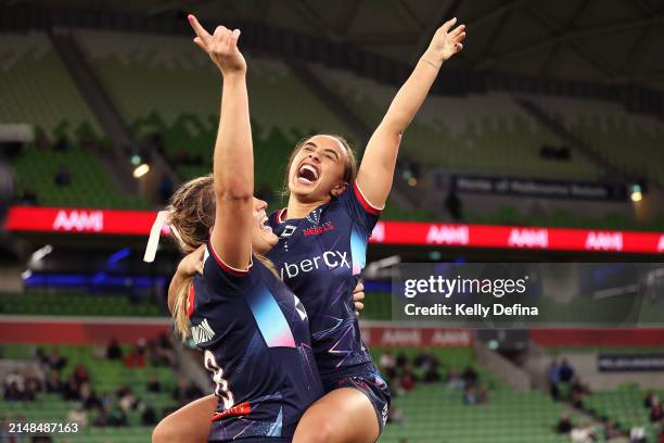 Chanelle Kohika-Skipper of the Rebels and Grace Hamilton of the Rebels celebrate winning during the round five Super Rugby Women's match between...