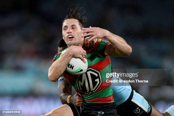 Cameron Murray of the Rabbitohs is tackled by Sione Katoa of the Sharks during the round six NRL match between South Sydney Rabbitohs and Cronulla...