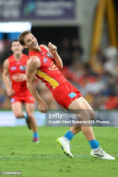 Noah Anderson of the Suns celebrates kicking a goal during the round five AFL match between Gold Coast Suns and Hawthorn Hawks at People First...
