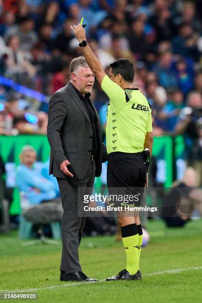 Ufuk Talay, coach of Sydney FC receives a yellow card from Referee Alireza Faghani during the A-League Men round 24 match between Sydney FC and...