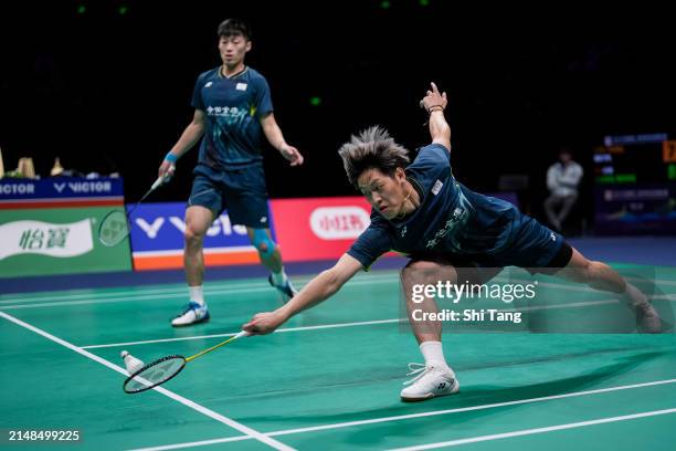 Lee Jhe-Huei and Yang Po-Hsuan of Chinese Taipei compete in the Men's Doubles Semi Finals match against Liang Weikeng and Wang Chang of China during...