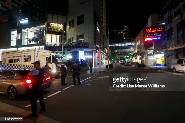 Police vehicles arrive at Westfield Bondi Junction on April 13, 2024 in Bondi Junction, Australia. Six victims, plus the offender, are confirmed dead...