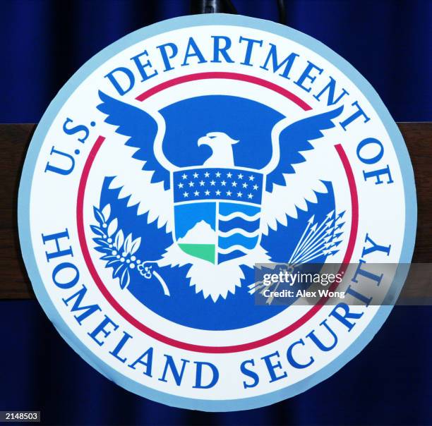 The recently unveiled seal of the U.S. Department of Homeland Security is shown displayed on a podium at a media conference announcing Operation...