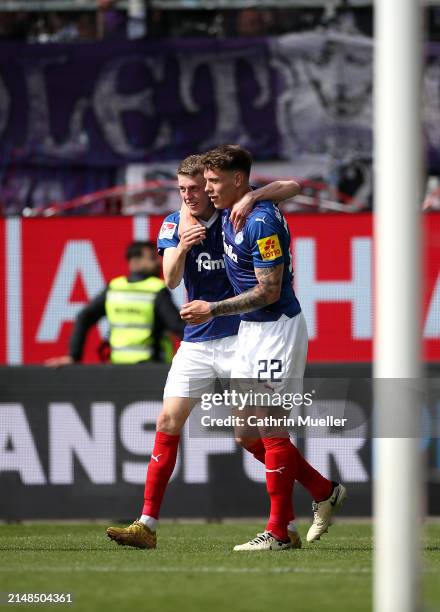 Alexander Bernhardsson of Holstein Kiel celebrates with teammate Nicolai Remberg after scoring the team's fourth goal during the Second Bundesliga...