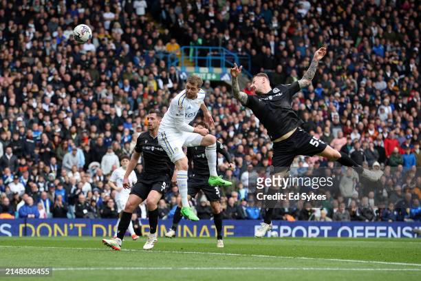 Patrick Bamford of Leeds United heads a shot whilst under pressure from Kyle McFadzean of Blackburn Rovers during the Sky Bet Championship match...