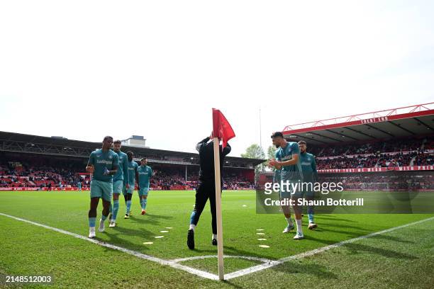 Wolverhampton Wanderers players warm up prior to the Premier League match between Nottingham Forest and Wolverhampton Wanderers at City Ground on...