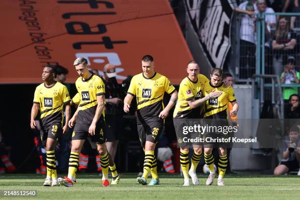 Marcel Sabitzer of Borussia Dortmund celebrates scoring his team's first goal with teammate Marius Wolf during the Bundesliga match between Borussia...