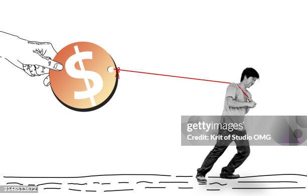 the young man tugs at the coin - man dragging something stock pictures, royalty-free photos & images