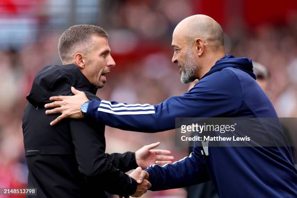 Gary O'Neil, Manager of Wolverhampton Wanderers, interacts with Nuno Espirito Santo, Manager of Nottingham Forest, prior to the Premier League match...
