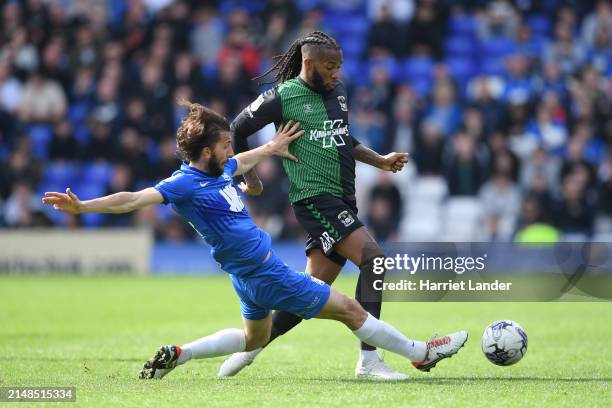 Kasey Palmer of Coventry City is challenged by Ivan Sunjic of Birmingham City during the Sky Bet Championship match between Birmingham City and...