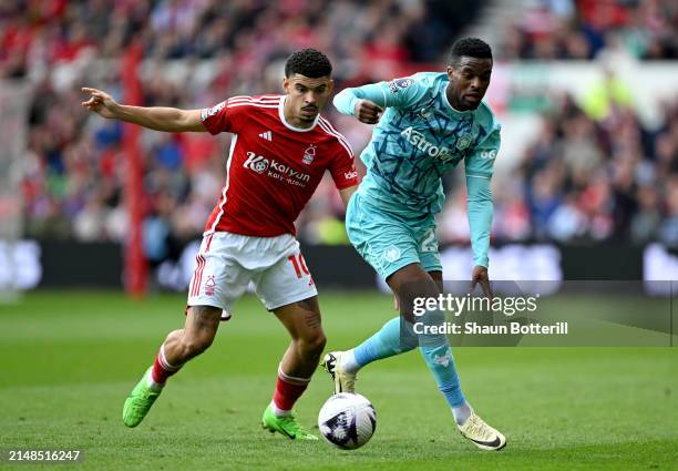 Nelson Semedo of Wolverhampton Wanderers battles for possession with Morgan Gibbs-White of Nottingham Forest during the Premier League match between...