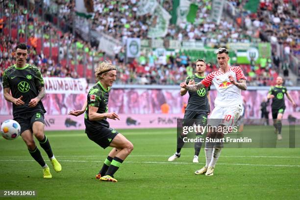 Benjamin Sesko of RB Leipzig scores his team's second goal during the Bundesliga match between RB Leipzig and VfL Wolfsburg at Red Bull Arena on...