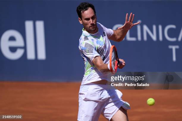Gianluca Mager of Italy plays a forehand against Bernabe Zapata Miralles of Spain during qualifying round of Barcelona Open Banc Sabadell 2024 at...
