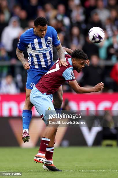 Igor of Brighton & Hove Albion wins a header whilst under pressure from Lyle Foster of Burnley during the Premier League match between Burnley FC and...