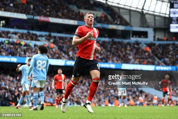 Ross Barkley of Luton Town celebrates scoring his team's first goal during the Premier League match between Manchester City and Luton Town at Etihad...