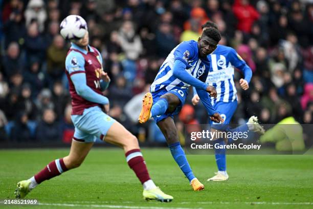 Carlos Baleba of Brighton & Hove Albion shoots during the Premier League match between Burnley FC and Brighton & Hove Albion at Turf Moor on April...