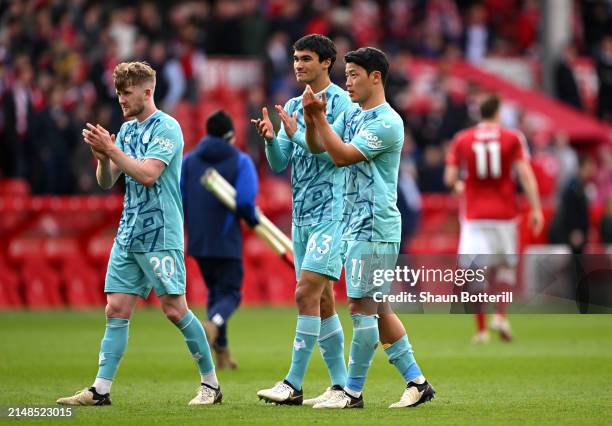 Tommy Doyle, Nathan Fraser and Hwang Hee-Chan of Wolverhampton Wanderers during the Premier League match between Nottingham Forest and Wolverhampton...