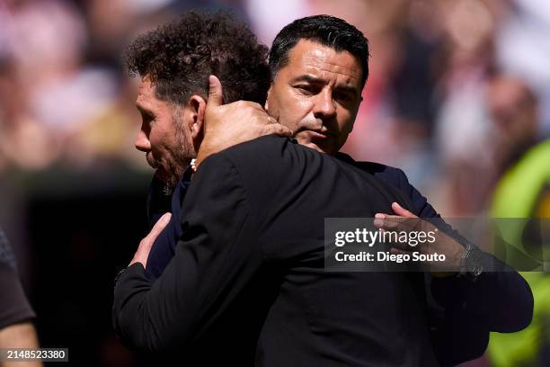 Diego Simeone head coach of Atletico de Madrid greets Michel Sanchez head coach of Girona FC prior the game the LaLiga EA Sports match between...