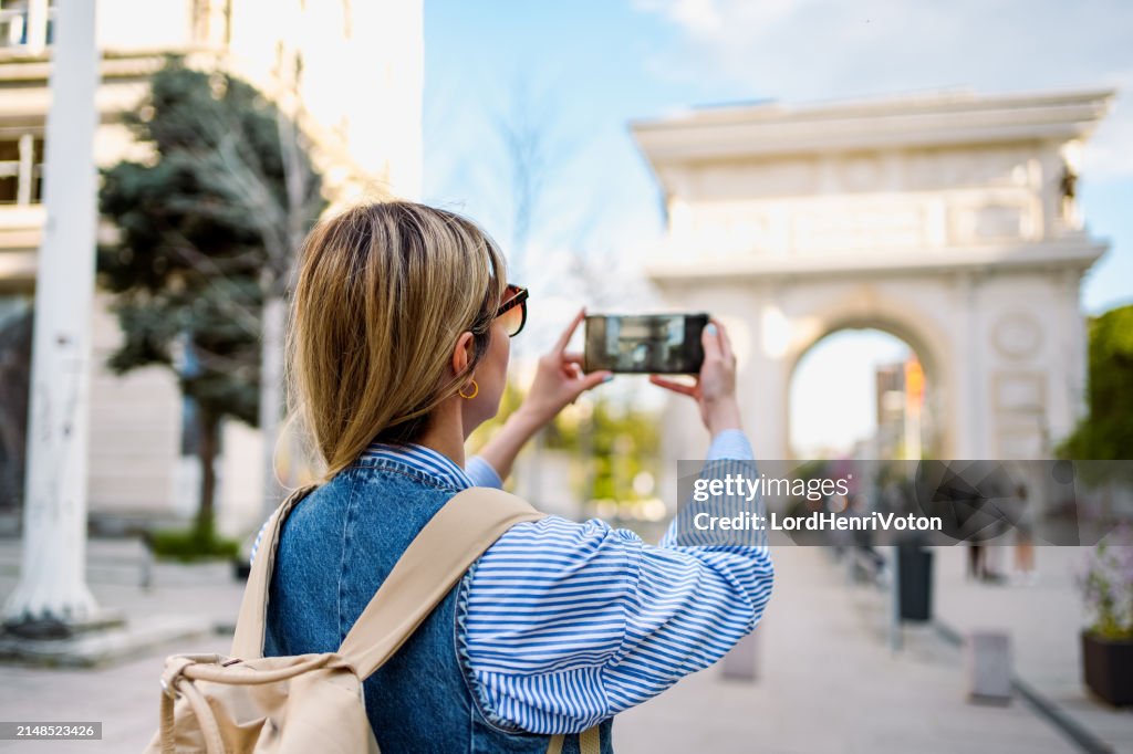 Woman taking photos in Skopje