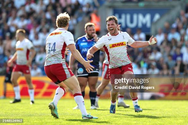 Louis Lynagh and Will Evans of Harlequins celebrate following the team's victory during the Investec Champions Cup Quarter Final match between Union...