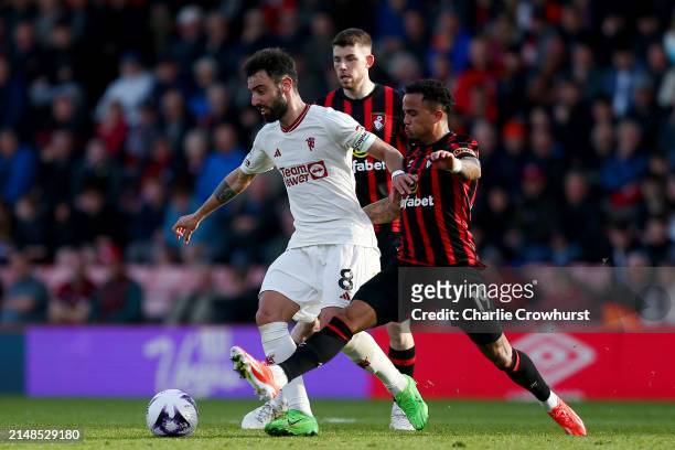 Bruno Fernandes of Manchester United is challenged by Justin Kluivert of AFC Bournemouth during the Premier League match between AFC Bournemouth and...