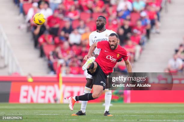 Antonio Ruediger of Real Madrid competes for the ball with Vedat Muriqi of RCD Mallorca during the LaLiga EA Sports match between RCD Mallorca and...