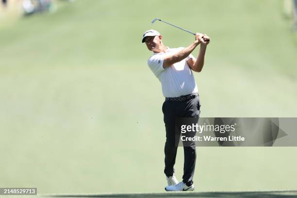 Lucas Glover of the United States plays his shot on the first hole during the third round of the 2024 Masters Tournament at Augusta National Golf...