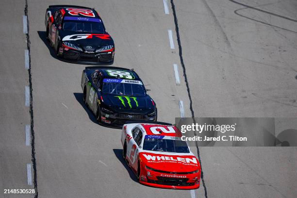 Jesse Love, driver of the Whelen Chevrolet, Riley Herbst, driver of the Monster Energy Ford, and Ryan Truex, driver of the The Toyota Gazoo Racing...