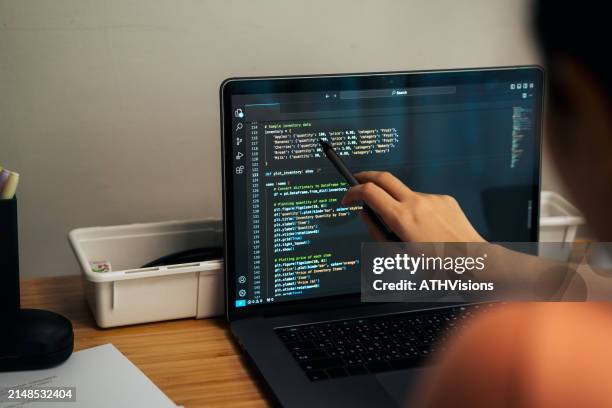 a dedicated professional engages in a coding session in a cozy home office - green html code stock pictures, royalty-free photos & images