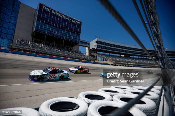 Chandler Smith, driver of the QuickTie Toyota, Justin Allgaier, driver of the BRANDT/TradeMark Nitrogen Chevrolet, and Cole Custer, driver of the...