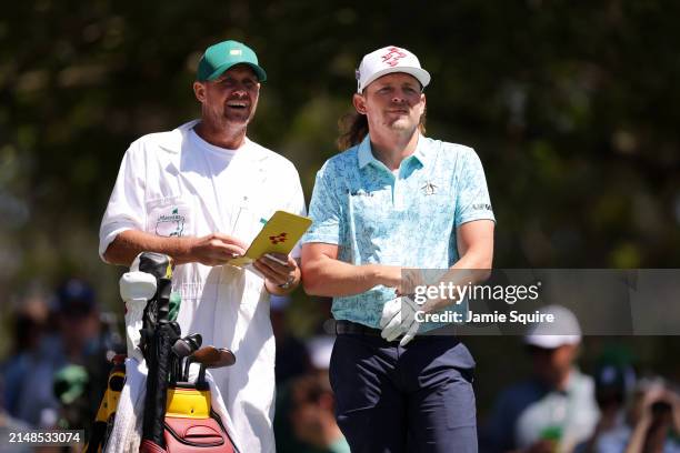 Cameron Smith of Australia and caddie Sam Pinfold line up a shot from the fourth tee during the third round of the 2024 Masters Tournament at Augusta...