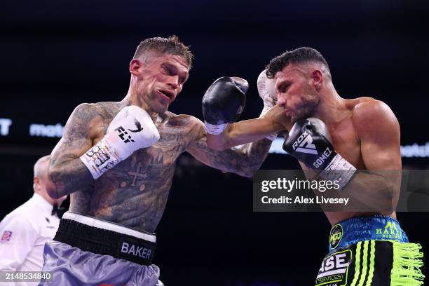 Kane Baker and Michael Gomez Jnr exchange punches during the BBBofC English Super Featherweight title fight between Michael Gomez Jnr and Kane Baker...