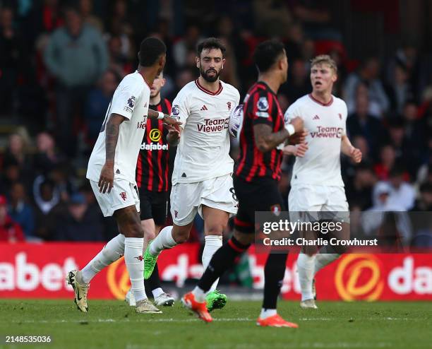 Bruno Fernandes of Manchester United celebrates scoring his team's second goal from the penalty spot with teammate Marcus Rashford during the Premier...