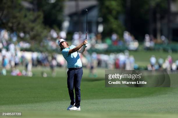 Cameron Smith of Australia plays his shot on the eighth hole during the third round of the 2024 Masters Tournament at Augusta National Golf Club on...