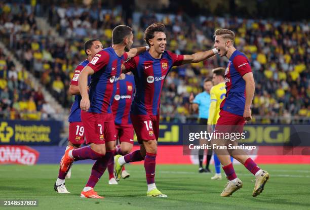 Joao Felix of FC Barcelona celebrates scoring his team's first goal with teammates Ferran Torres and Fermin Lopez of FC Barcelona during the LaLiga...