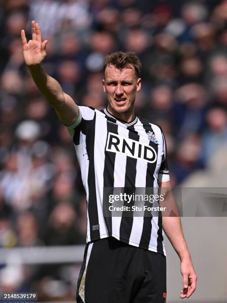 Newcastle United player Dan Burn reacts during the Premier League match between Newcastle United and Tottenham Hotspur at St. James Park on April 13,...