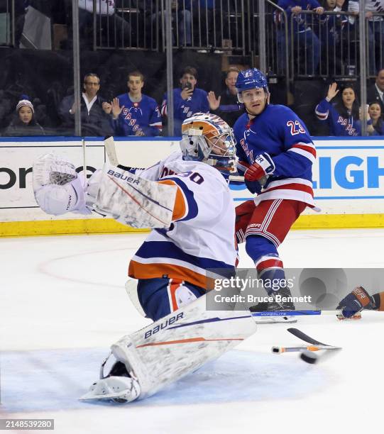 Ilya Sorokin of the New York Islanders makes an overtime save on Vincent Trocheck of the New York Rangers at Madison Square Garden on April 13, 2024...