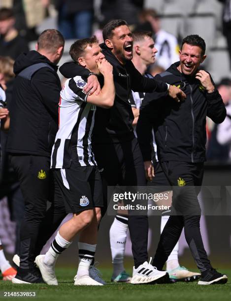 Newcastle United assistant coach Jason Tindall shares a joke with Matt Ritchie after the Premier League match between Newcastle United and Tottenham...