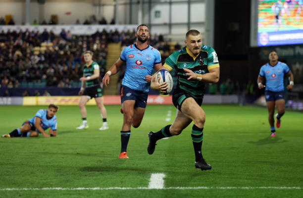 Ollie Sleightholme of Northampton Saints makes a break during the Investec Champions Cup Quarter Final match between Northampton Saints and Vodacom...