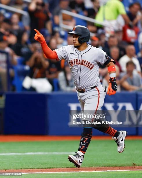 Thairo Estrada of the San Francisco Giants reacts after hitting a solo home run against the Tampa Bay Rays during the fourth inning at Tropicana...