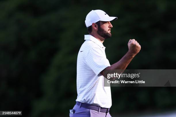 Scottie Scheffler of the United States reacts after making eagle on the 13th green during the third round of the 2024 Masters Tournament at Augusta...