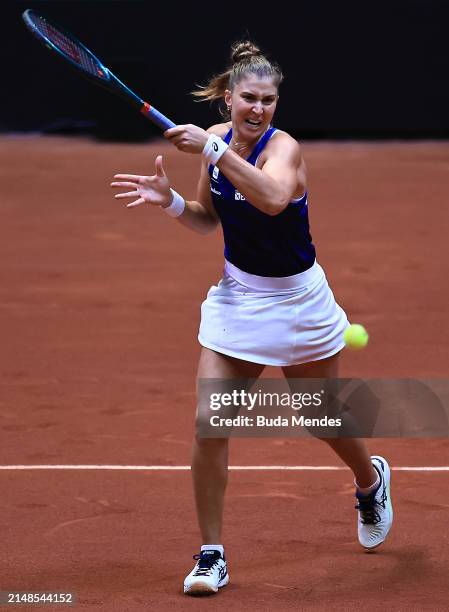 Beatriz Haddad of Brazil returns a shot to Anna-Lena Friedsam of Germany during the Billie Jean King Cup Qualifier match between Brazil and Germany...