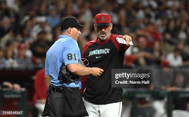 Manager Torey Lovullo of the Arizona Diamondbacks argues with home plate umpire Quinn Wolcott during the fifth inning of a game against the St Louis...