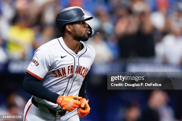 Jorge Soler of the San Francisco Giants reacts after hitting a solo home run against the Tampa Bay Rays during the seventh inning at Tropicana Field...