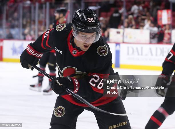 Erik Brannstrom of the Ottawa Senators juggles the puck during warm ups prior to a game against the Montreal Canadiens at Canadian Tire Centre on...