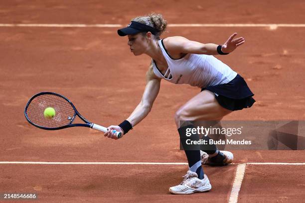 Laura Siegmund of Germany returns a shot to Carolina Alves of Brazil during the Billie Jean King Cup Qualifier match between Brazil and Germany at...