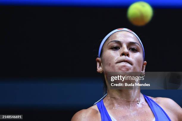 Carolina Alves of Brazil returns a shot to Laura Siegmund of Germany during the Billie Jean King Cup Qualifier match between Brazil and Germany at...